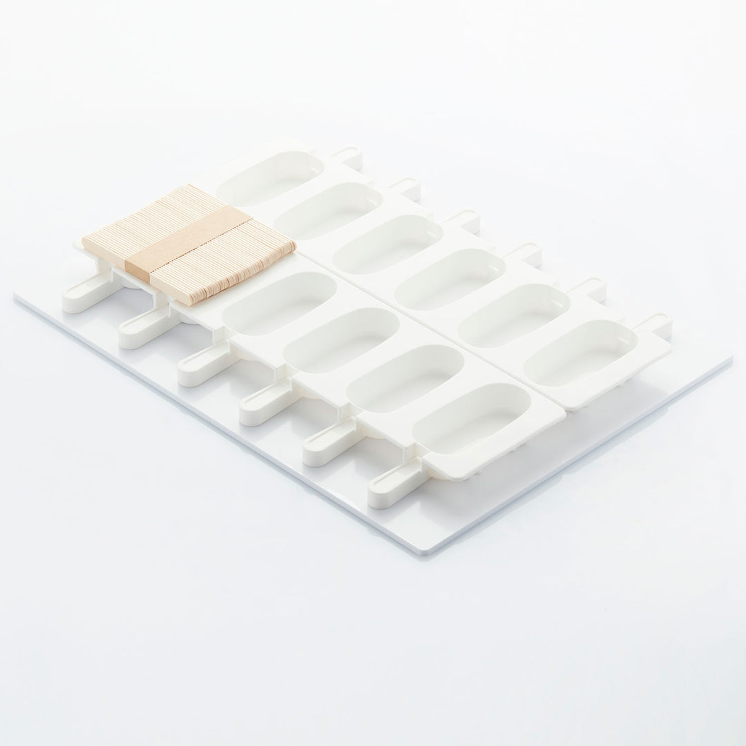 White popsicle mold with wooden sticks on a white background - Canadian Distributor