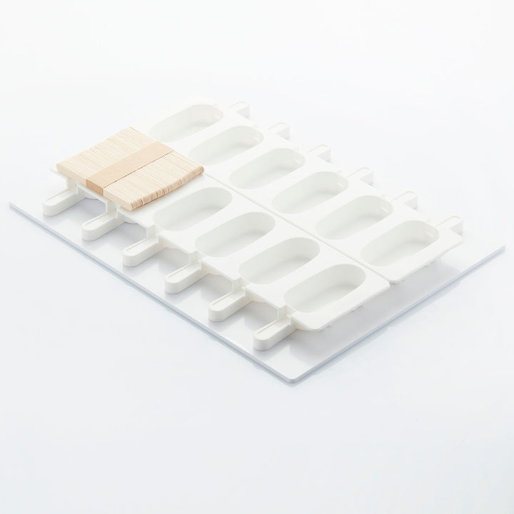 White popsicle mold with wooden sticks on a white background - Canadian Distributor
