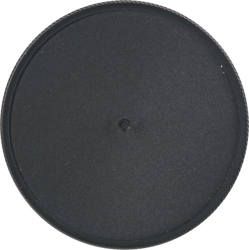 Black round object with a central hole on a white background