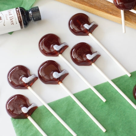 Rootbeer lollipops shaped like football helmets