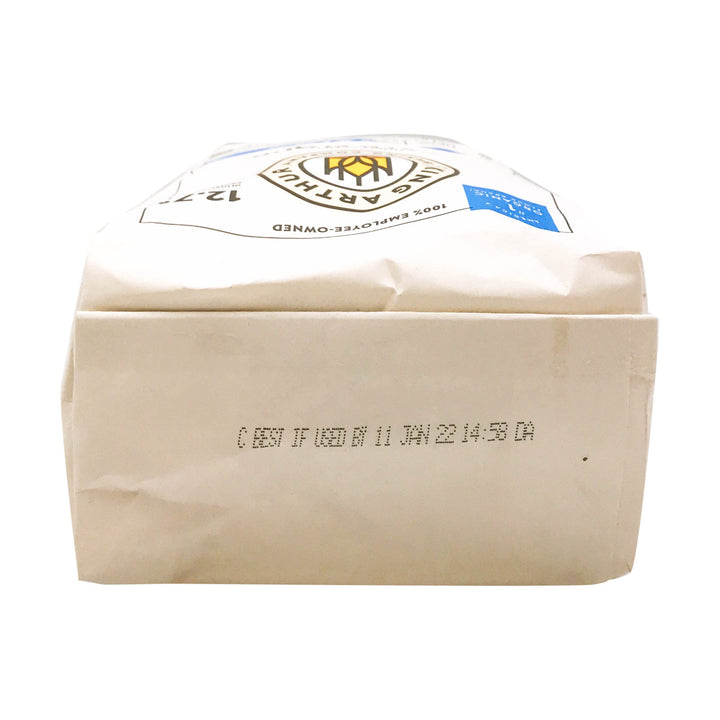 Beige food packaging with a clear plastic lid on a white background