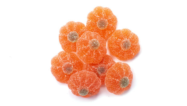 Sugared jelly mandarin candies on a white background 