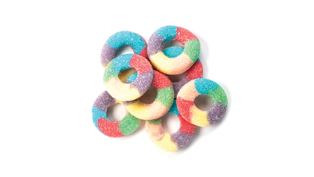 Colorful ring-shaped candies on a white background