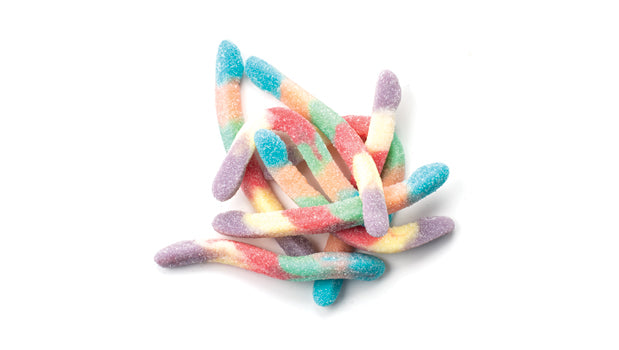 Colorful gummy worms on a white background