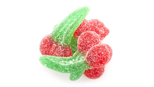 Red and green double cherry gummy candies (light sour) on a white background