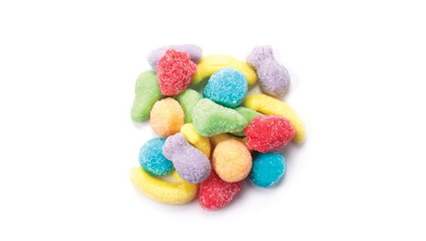 Sour gummy mini fruit mix candy on a white background