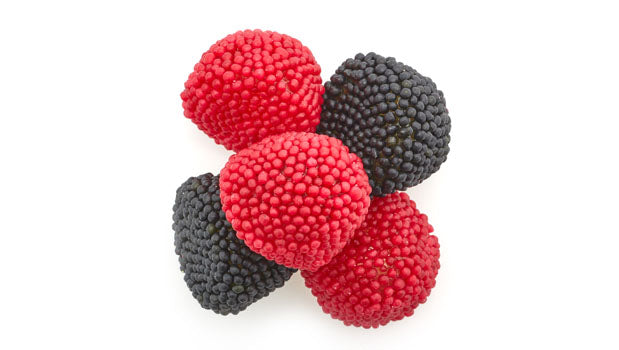 Gummy wild berries candy on a white background