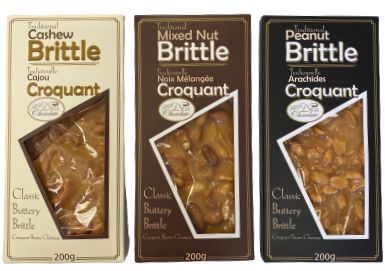 Three packages of Brittle candy with different flavors on a white background