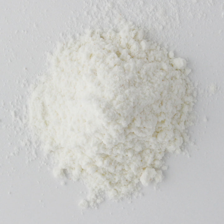 Close up of waffle powder substance on a light gray background