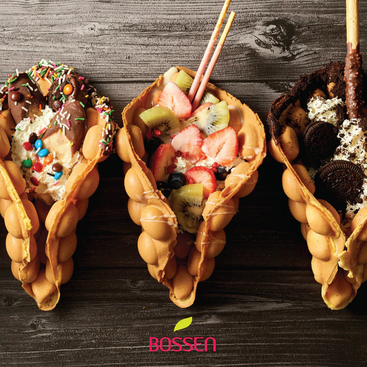 Three waffle cones filled with various toppings on a wooden surface, with 'BOSSEN' branding.