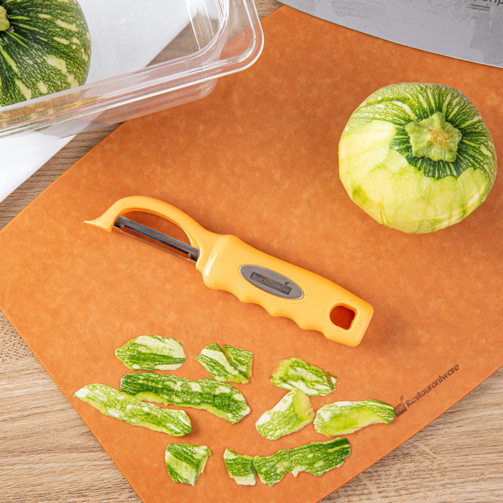 Restaurantware Comfy Grip 7.50In Stainless Steel Vegetable Peeler, Tangerine Orange - Restaurant Equipment and Smallwares - Canadian Distribution - Ships Free Within Canada on Orders Above CAD $199