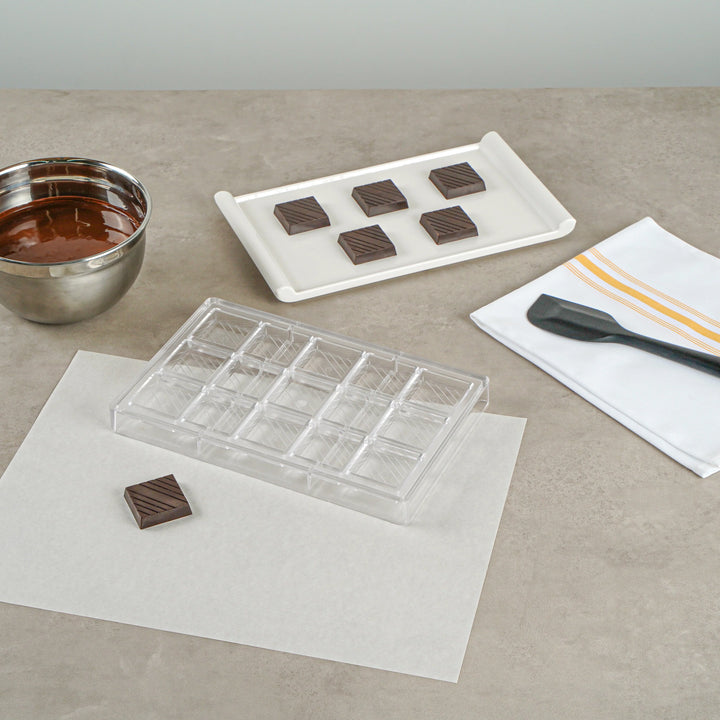 Restaurantware Pastry Tek 15-Compartment Square with Lines Candy & Chocolate Molds, Polycarbonate - 10 Units/Case - Restaurant Equipment and Smallwares - Canadian Distribution - Ships Free Within Canada on Orders Above CAD $199