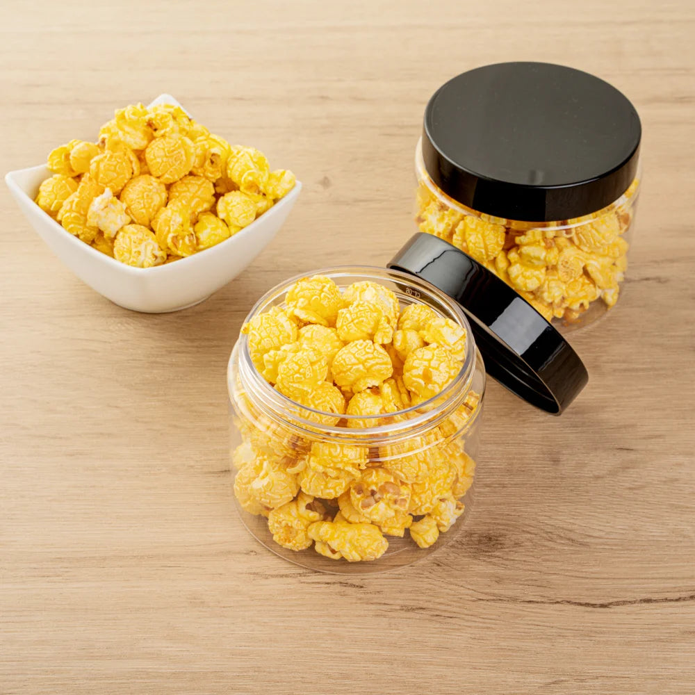 Restaurantware RW Base 16oz Clear Plastic Candy & Snack Jars, with Black Plastic Lid, 3.75 x 3.75 x 3In - Restaurant Equipment and Smallwares - Canadian Distribution - Ships Free Within Canada on Orders Above CAD $199