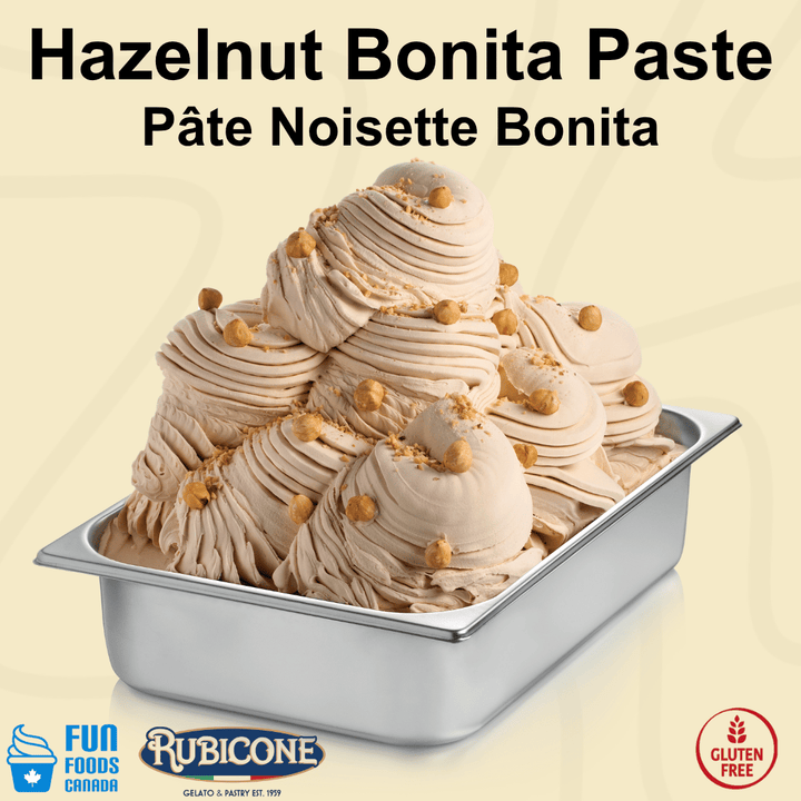A metal tub filled with swirls of hazelnut bonita ice cream topped with chopped nuts, on a pale beige background with the text 'Hazelnut Bonita Paste Pâte Noisette Bonita' at the top and Rubicone / Fun Foods Canada logos and gluten-free badge at the bottom. 