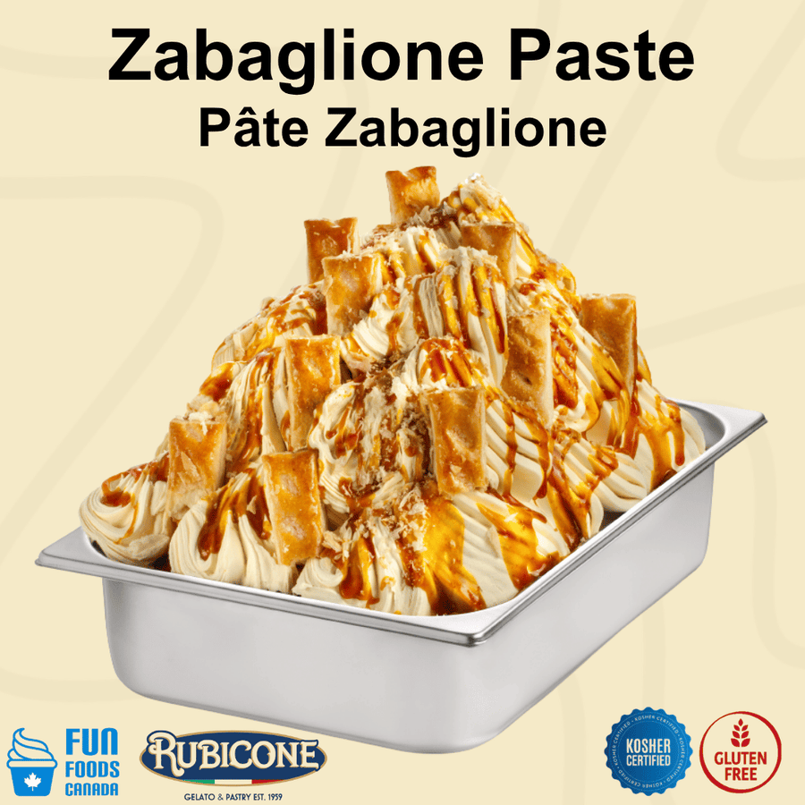 A metal food pan filled with Zabaglione Gelato, featuring a creamy beige mixture with glossy caramel-brown drizzle and pastry-like folded pieces on top. Large text at the top reads 'Zabaglione Paste Pâte Zabaglione,' with Fun Foods Canada and Rubicone logos at the bottom, along with kosher and gluten-free badges.
