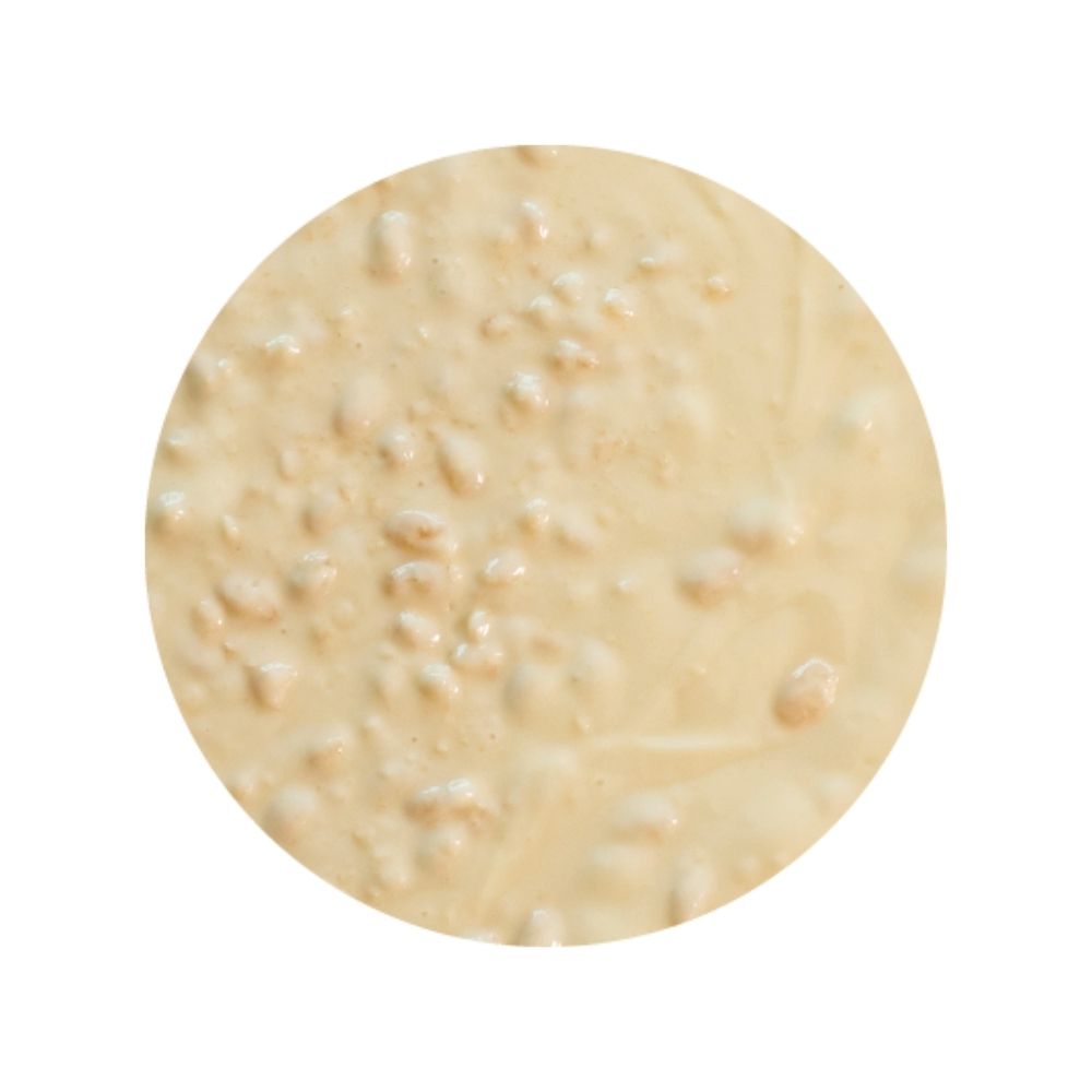 Texture image of white crunch sundae dessert topping - white chocolate sauce with crunchy cereal pieces