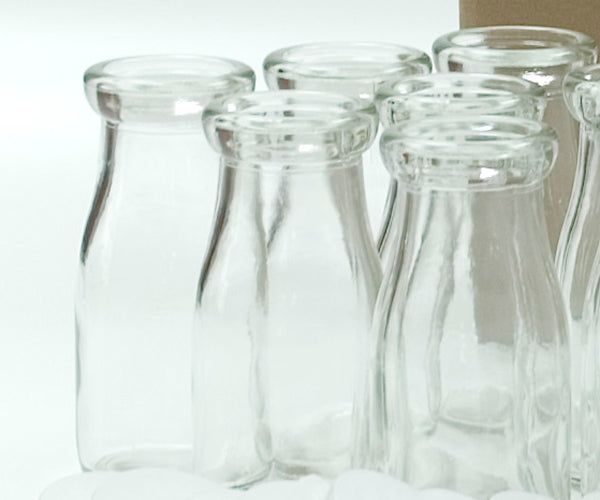 Canadian Distributor of Half Pint (236ml) Glass Bottles and Lids Combo Pack - 24 half pint bottles and 36 clear 56 mm Frigiseal lids per case - Ships Free Within Canada