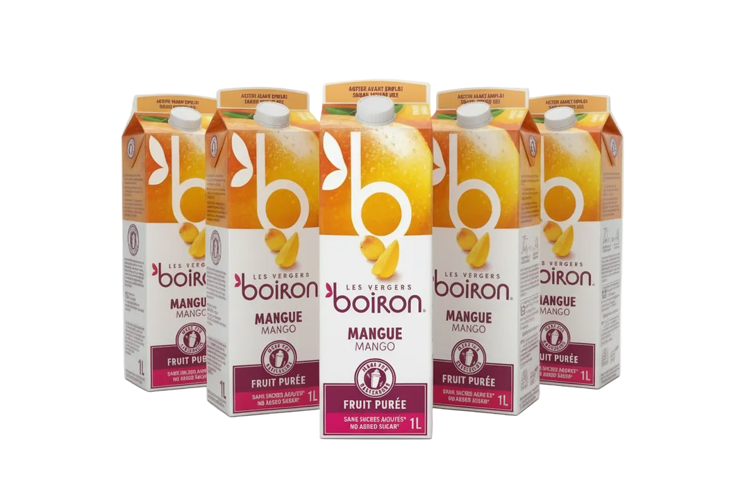 Cartons of Boiron Mango Fruit Puree on a white background