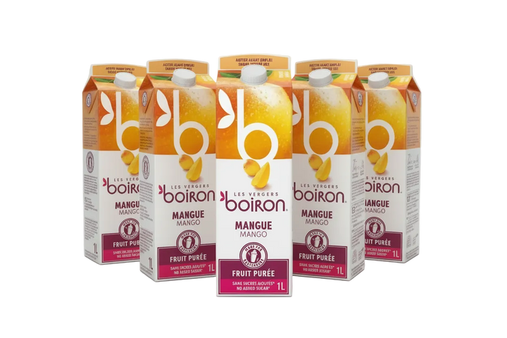 Cartons of Boiron Mango Fruit Puree on a white background