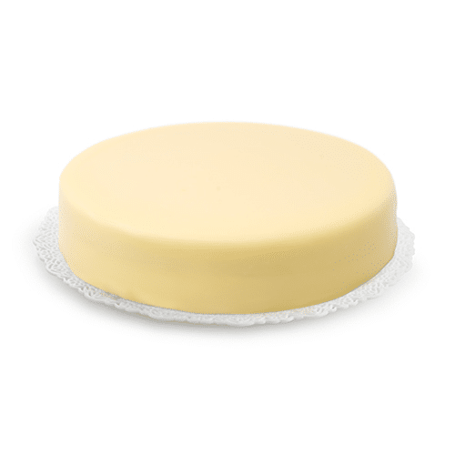White glaze coating a cake on a white background