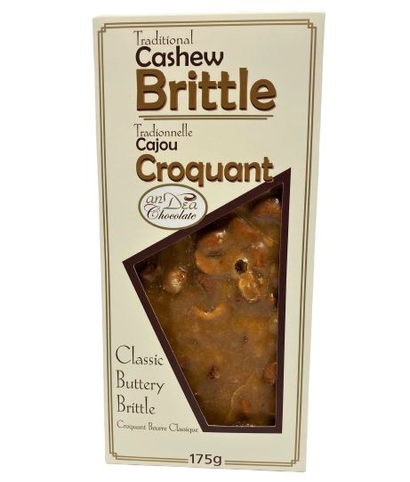 Box of Traditional Cashew Brittle with a clear window showing the brittle inside.