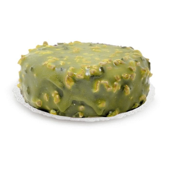 Rubicone Pistachio Crock Glaze coating on a cake on white background