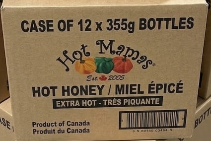 Cardboard box of Hot Mama's Hot Honey bottles with product details.