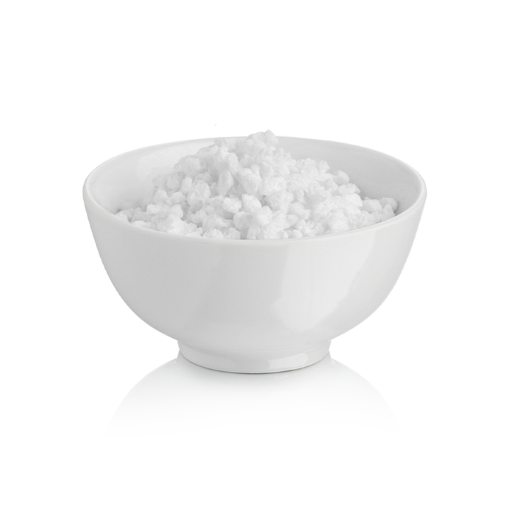 White bowl filled with Rubicone chopped meringue on a white background