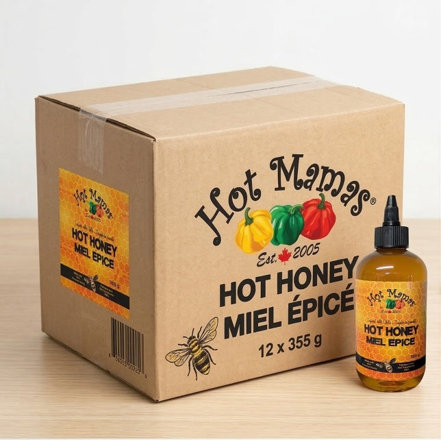 Hot Mamas hot honey packaging including a cardboard box and a bottle on a light background