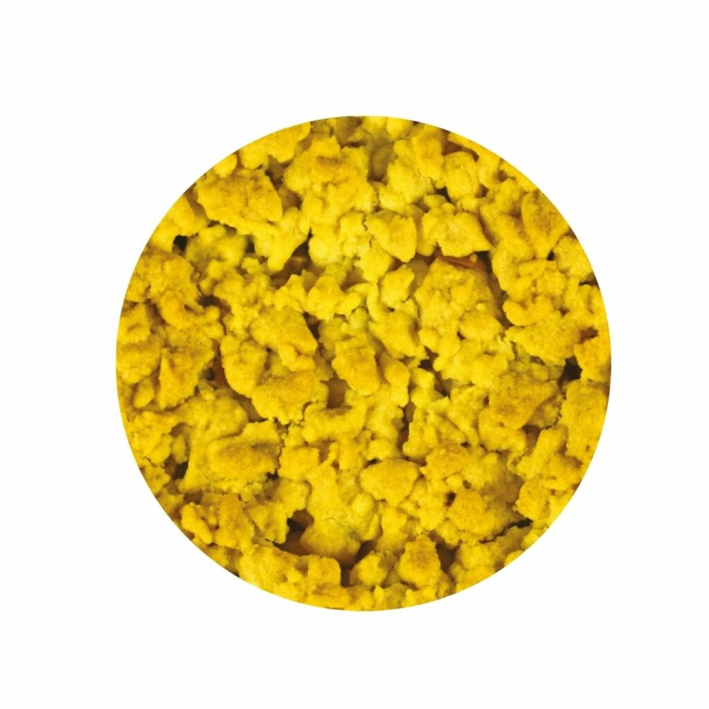 Close up texture image of lemon crumble on a white background