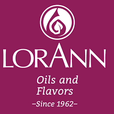 Lorann Oils and Flavors logo on a magenta background for Canada 