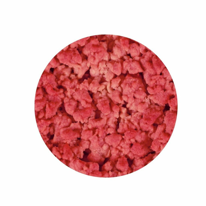 Round pinkish-red crumbly material on a white background - Close up texture image of raspberry crumble 