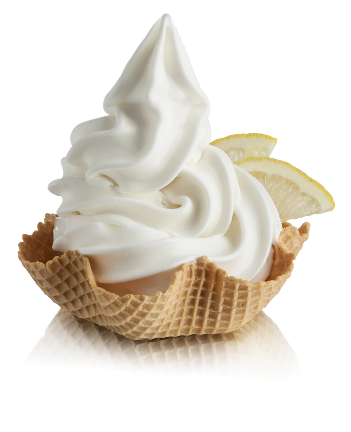 Lemon Soft Serve in a waffle cup with lemon wedges made with Lemon Ready Base for Gelato & Soft Serve  
