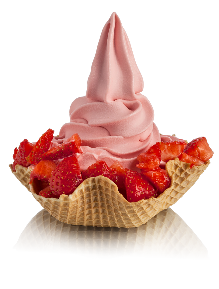 Strawberry Soft Serve Gelato ice cream in a waffle cup with strawberry pieces made with Rubicone Strawberry Ready Gelato and Soft Serve Base 